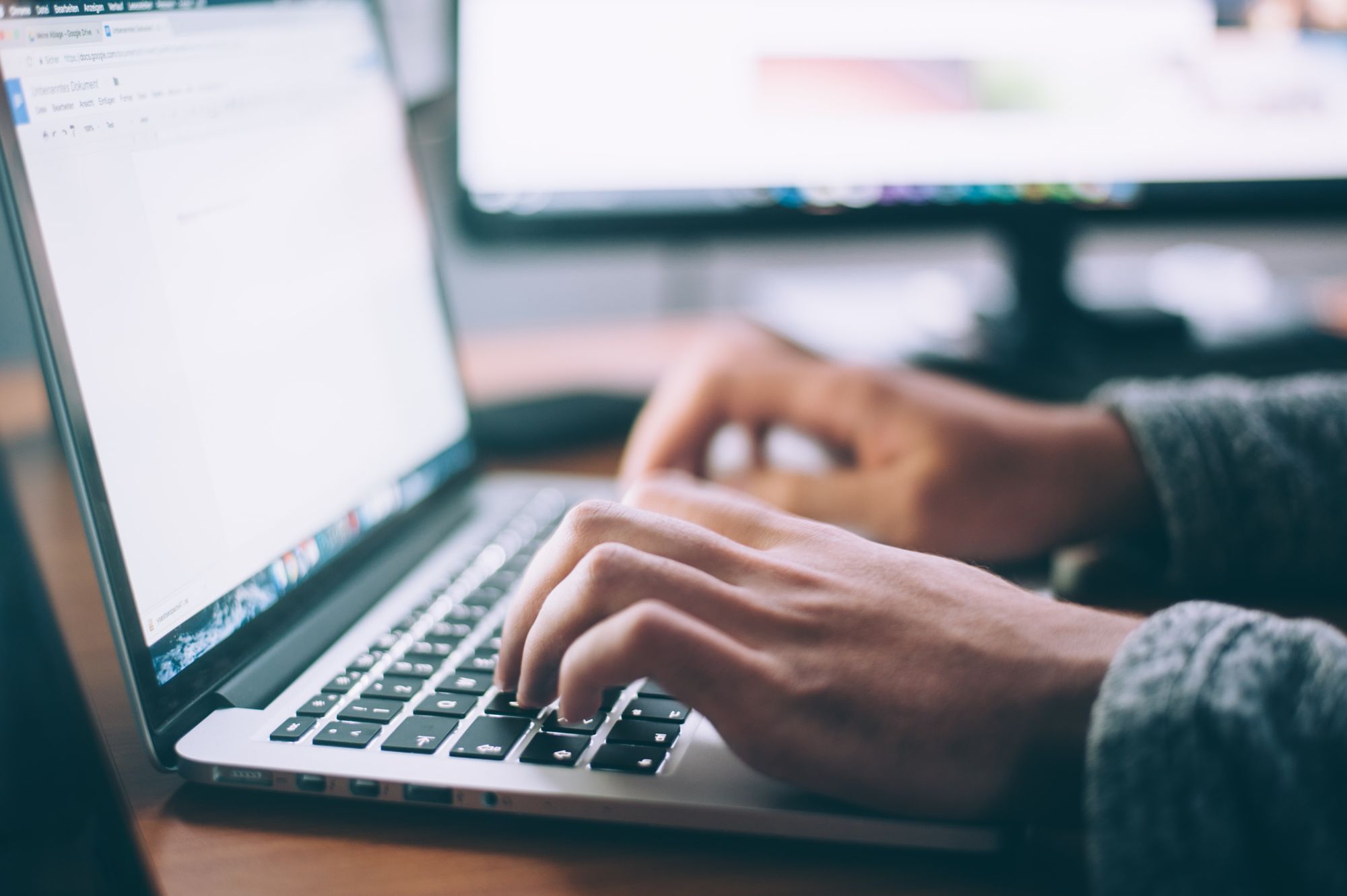 Man typing computer